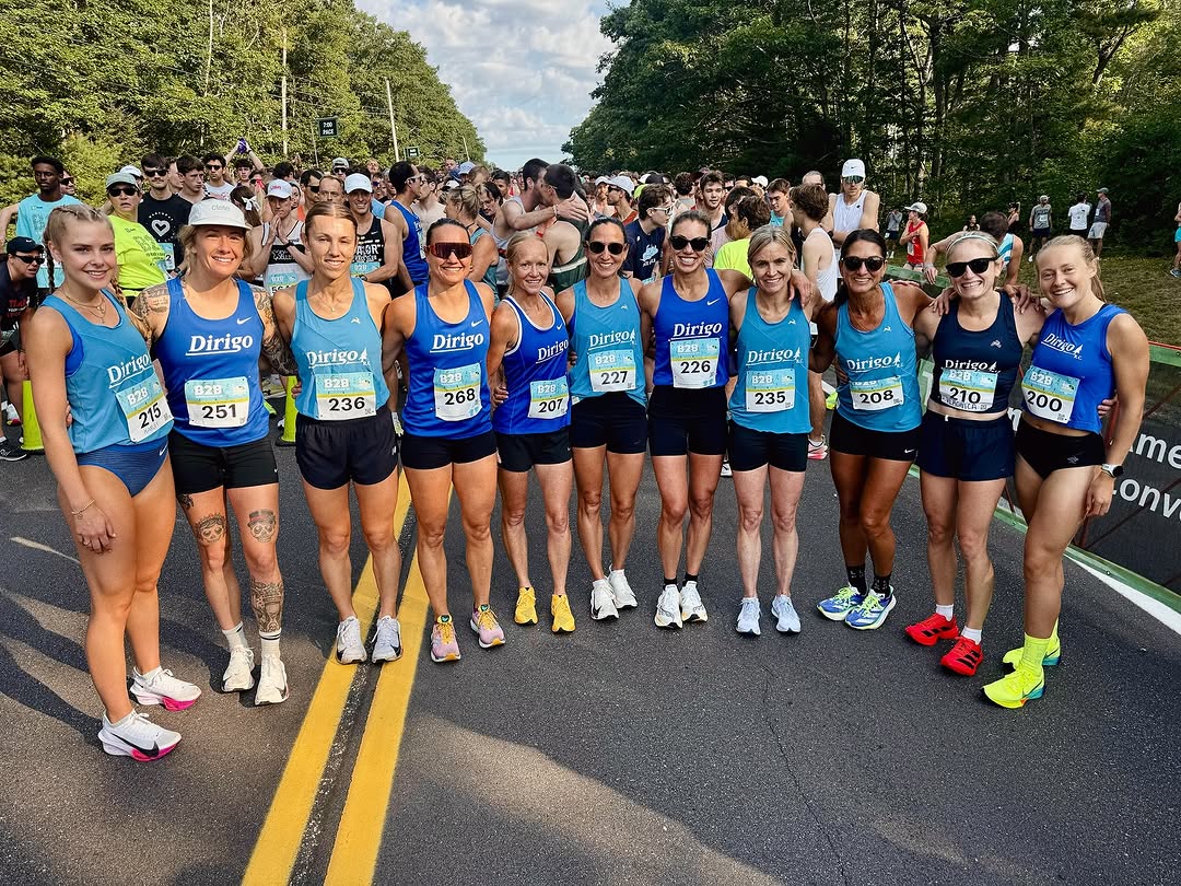 Dirigo runners in blue team singlets gathered before a race. Instagram source image pending final approval.